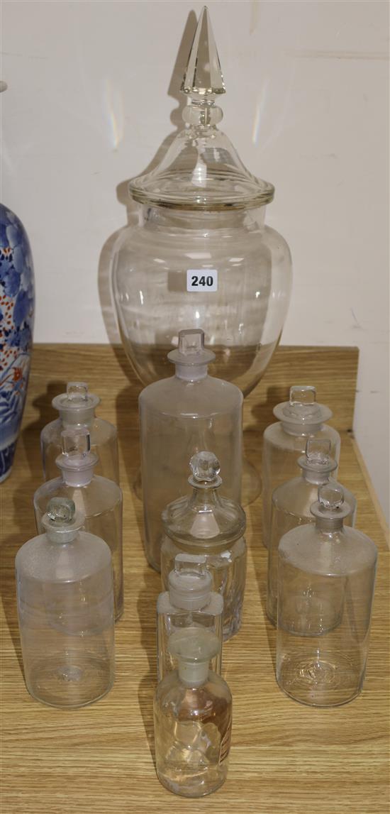 A collection of chemists jars and a large chemist lidded display jar